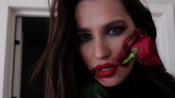 Beautiful Makeup with Blood and Rose in Mouth