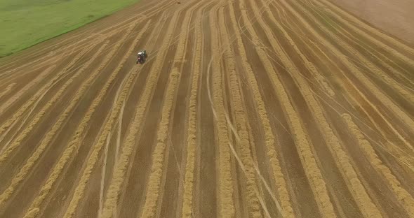 Topdown View of Harvesters Working in a Wheat Field