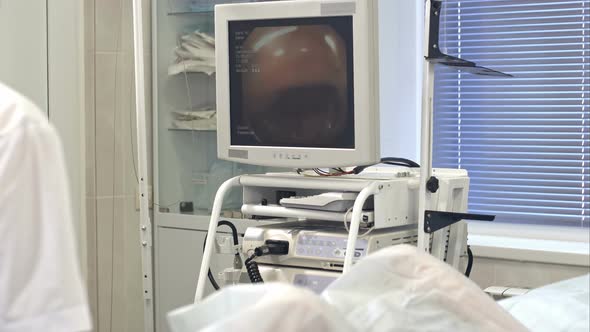 Surgeon Looking at the Monitor During Endoscopy