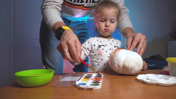Dad Helping Daughter Colorizing Hand Made Craft Pumpking