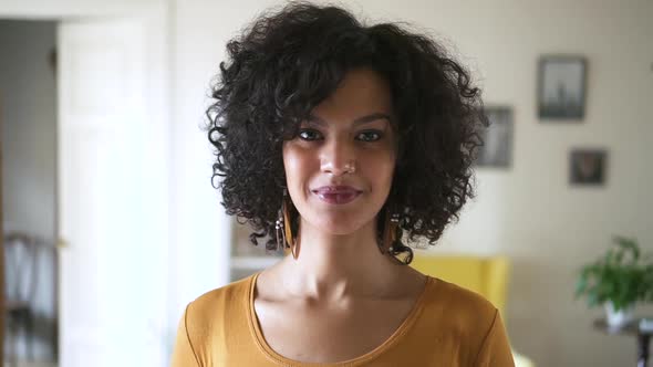 Pretty Face of Young Mixed Race Woman Model Standing Inside Living Room Spbd