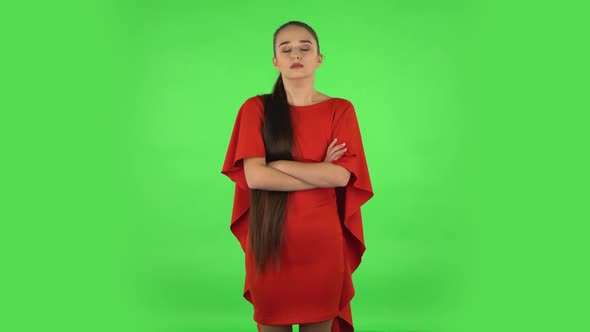 Pretty Young Woman Is Listening To Boring Information. Green Screen