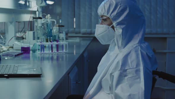 Disabled Female Epidemiologist Working in Lab