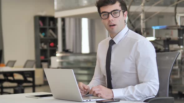 Yes Businessman Shaking Head for Acceptance Toward Camera