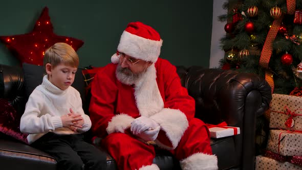 Cute Little Boy Tells Santa Claus About His Dreams and Receives Cherished Gift