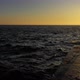 Slow Motion Female Walking by The Ocean with Waves on Sunset - VideoHive Item for Sale