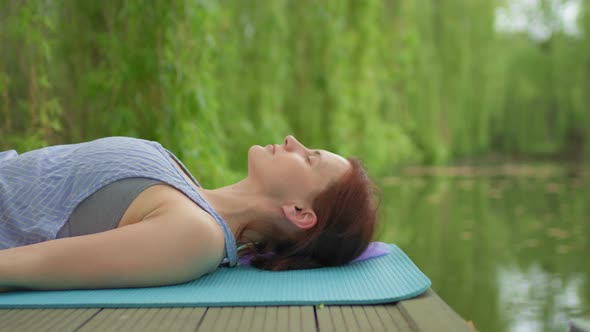 30s Woman Doing Meditation Practice Outdoors