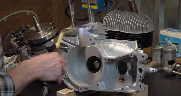 Motorcycle Engine Parts Heating Before Assembling in Repair Shop Garage