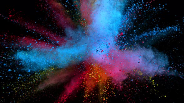 Super Slowmotion Shot of Color Powder Explosions Isolated on Black Background