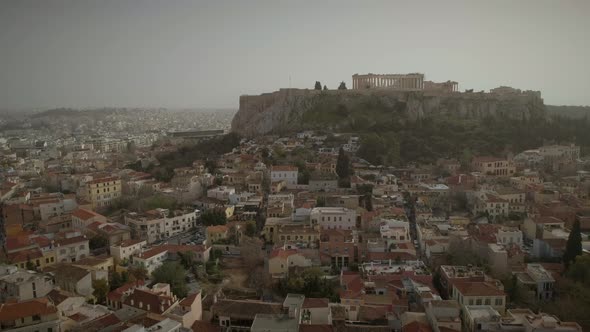 Aerial view of the parthenon temple on acropolis hill and the skyline of Athens.