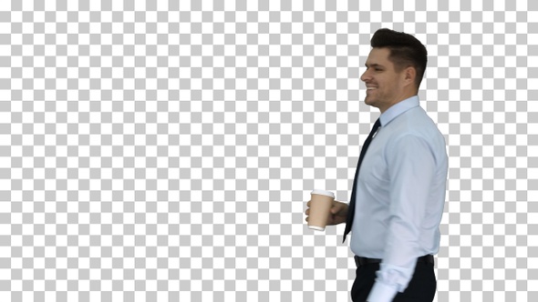 Businessman walking with take away coffee and paper bag