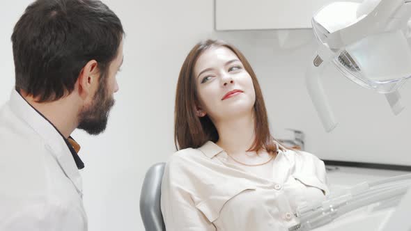 Lovely Young Woman Having Her Teeth Checked By Dentist