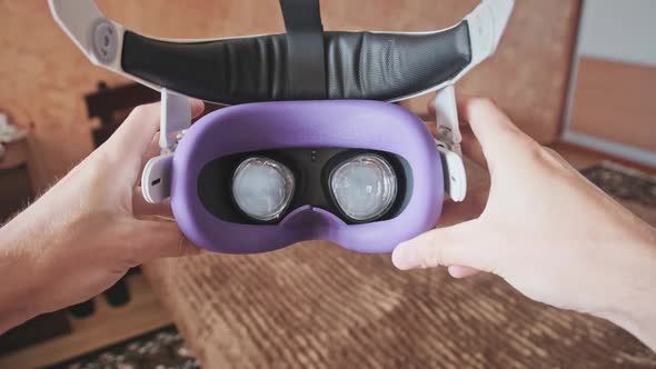 POV of Putting on VR Glasses Virtual Reality in the Bedroom