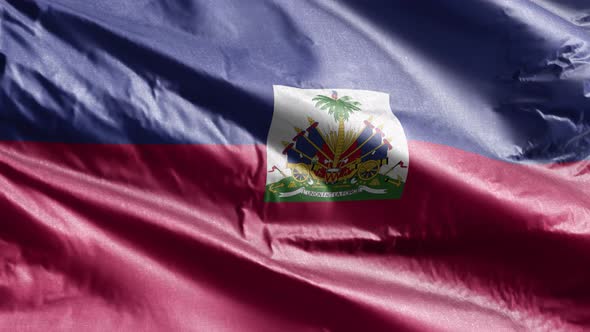 Haiti textile flag waving on the wind. Slow motion. 20 seconds loop.