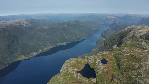 Flying above Norwegian fjord Veafjorden and over the Mountains