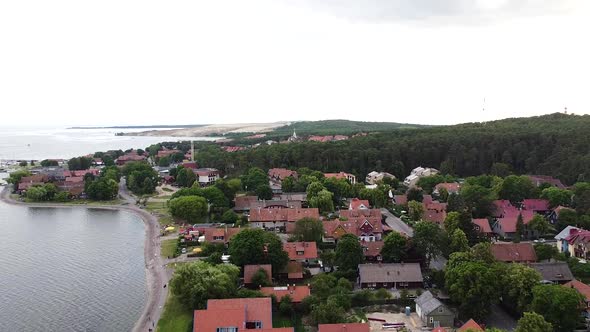 Lithuanian resort Nida town with magical red rooftops, aerial drone view