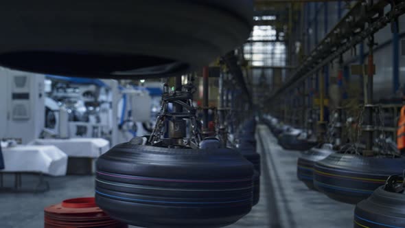 Tyre Production Plant Workers at Storage Facility Working with Modern Machines