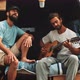 Two men sitting in back of a van singing and playing the guitar - VideoHive Item for Sale