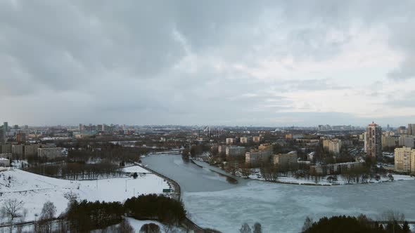 Suburb of a big city. City block from the height of the flight. Pond in the city park.