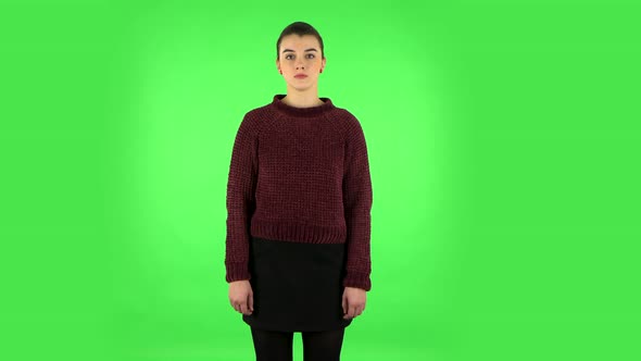 Woman Standing, Spreads Out in a Smile and Looks at the Camera, Green Screen