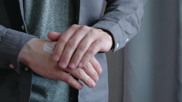 Male Applying Hand Cream