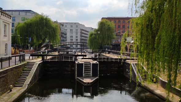 Famous London's Camden Lock view on a very quiet and sunny day. Almost no one is seen walking past a