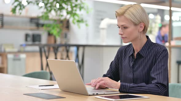 Young Businesswoman Working on Laptop in Office 