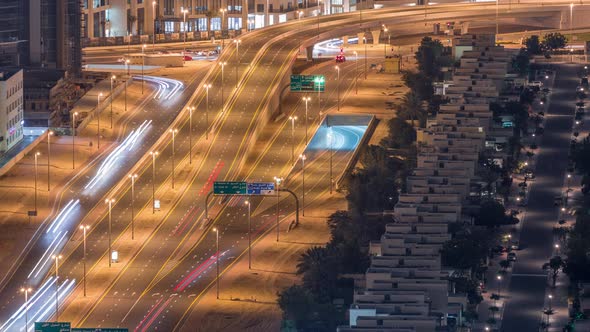 Traffic on the Road in Jumeirah Lakes Towers District Aerial Night Timelapse