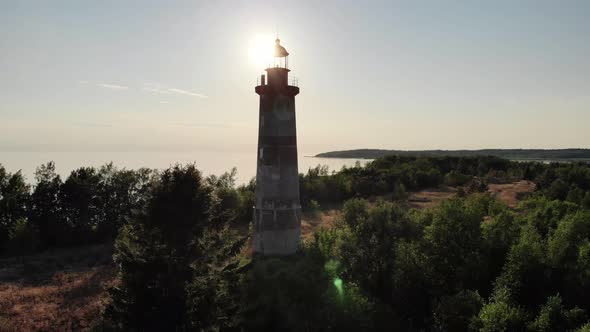 Time-worn lighthouse on small Heinaluoto island at Ladoga Lake, aerial shot