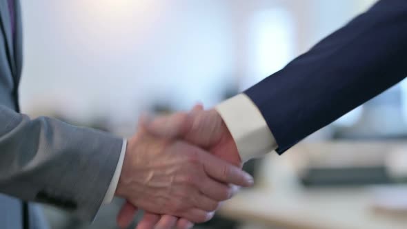 Close Up of Hand Shake Gesture By Two Businessmen