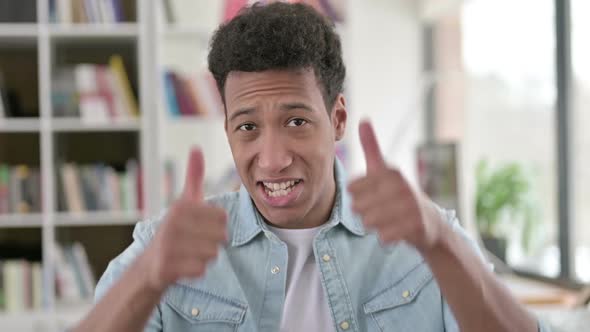 Thumbs Up By Cheerful Young African American Man