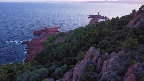 A beautiful aerial landscape of the coast of France and the Golden Island at sunset