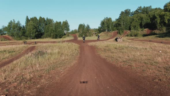 Drone Shot of Motorcyclists Racing on Off-Road Track