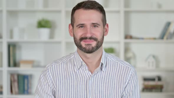 Portrait of Positive Young Man Showing OK Sign