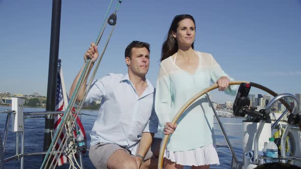 Young couple on sailboat together. Shot on RED EPIC for high quality 4K, UHD, Ultra HD resolution.