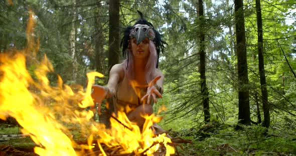 Ancient Savage Witch Is Burning Fire in Forest for Calling Rain, Moving Hands