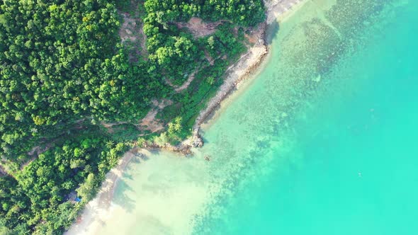 Aerial drone view panorama of beautiful seashore beach lifestyle by blue green lagoon and white sand