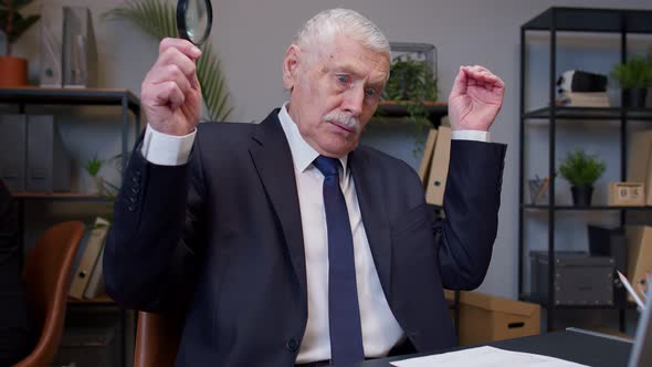 Elderly Old Businessman Checking Paperwork Correspondence at Office Shocked Surprised Disbelief