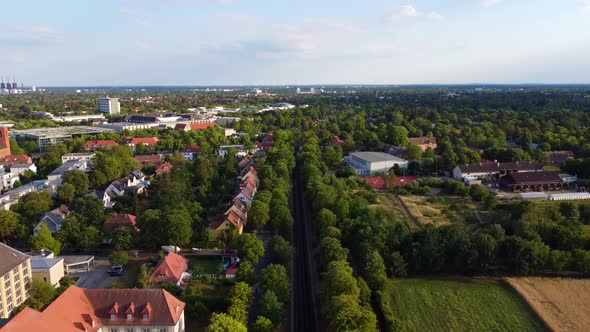 In the background the free university buildings.Smooth aerial view flight fly backwards drone foota