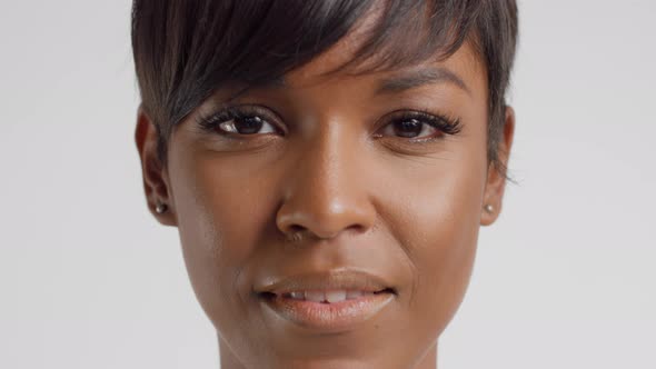 Front View Closeup Portrait of Mixed Race Woman with Short Haircut Watching To the Camera and