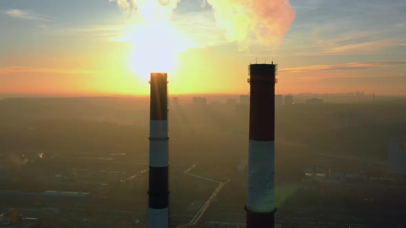 Chimneys of an Industrial Enterprise Top View at Sunset Time