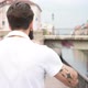 slow motion young beautiful man walking away wearing headphones - VideoHive Item for Sale
