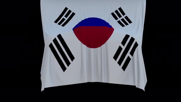 The piece of cloth falls with the flag of the State of Korea to cover the product