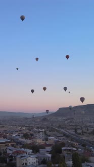 Vertical Video of Hot Air Balloons Flying in the Sky Over Cappadocia Turkey