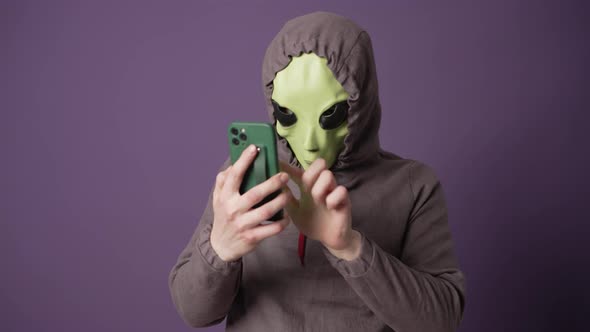 Green Alien Studies Human Technologies Looking at Phone