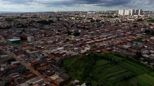 The Sol Nascente favela below and modern high-rise buildings in the distance - aerial view