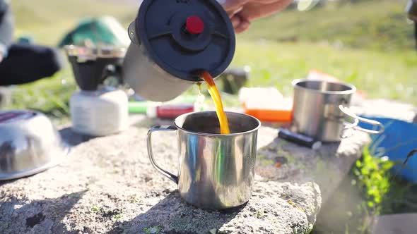 Pouring Coffee From French Press at Nature Outdoor