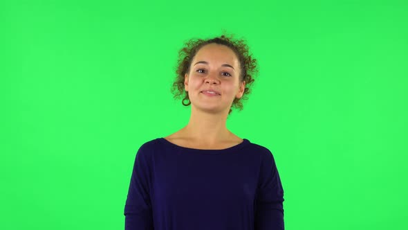 Portrait of Curly Woman Proud of Himself. Green Screen