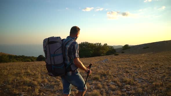 Man Hiker Walk on Mountain Hike Travel Peak with Black Sea Bakground