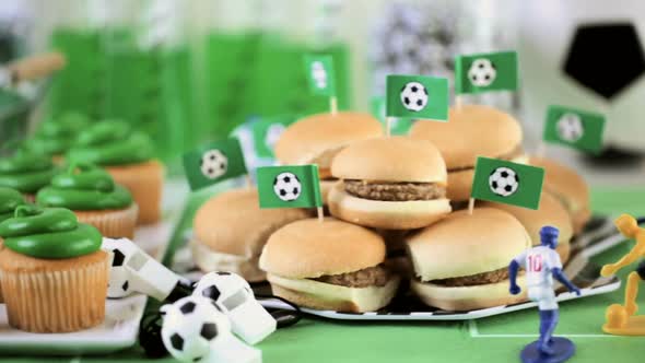 Kids football party set with snacks and drinks.